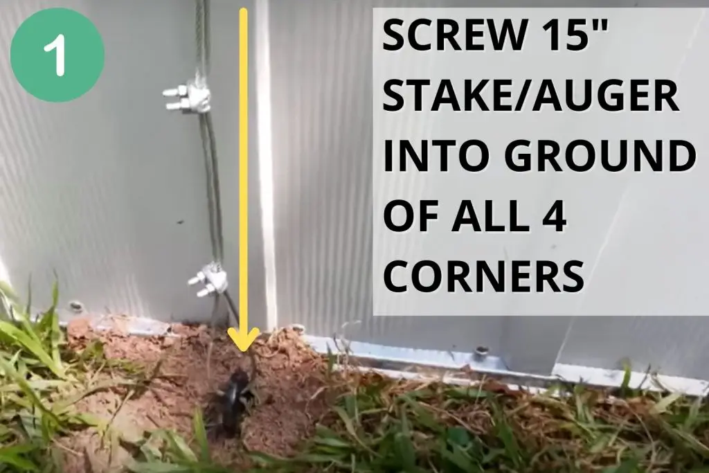 Screw stake/auger into ground of all 4 corners of your chicken coop.