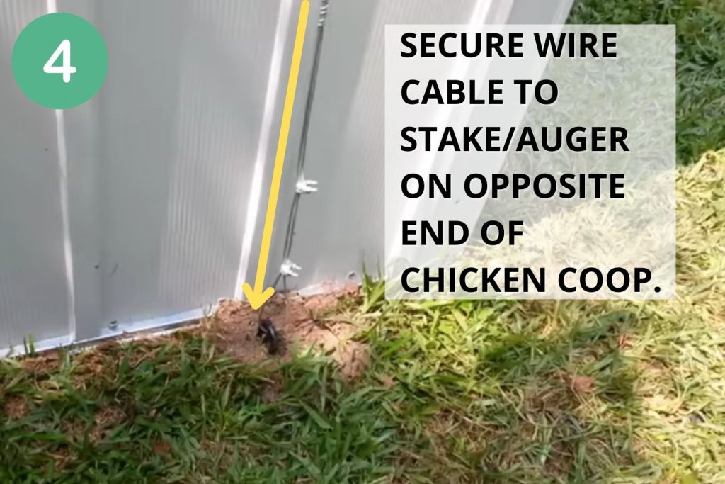 Secure wire cable to stake/auger on opposite end of chicken coop.