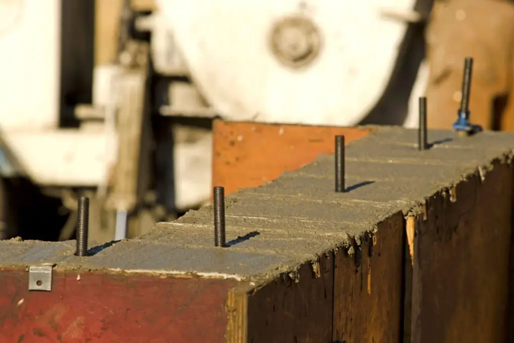 USE ANCHOR BOLTS TO SECURE YOUR NESTING BOXES WHEN BUILDING YOUR CHICKEN COOP.