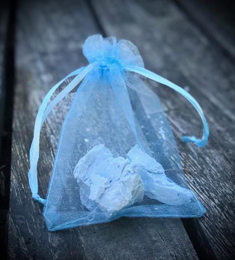 CUT UP IRISH SPRING SOAP AND PLACE PIECES IN A MESH BAG.